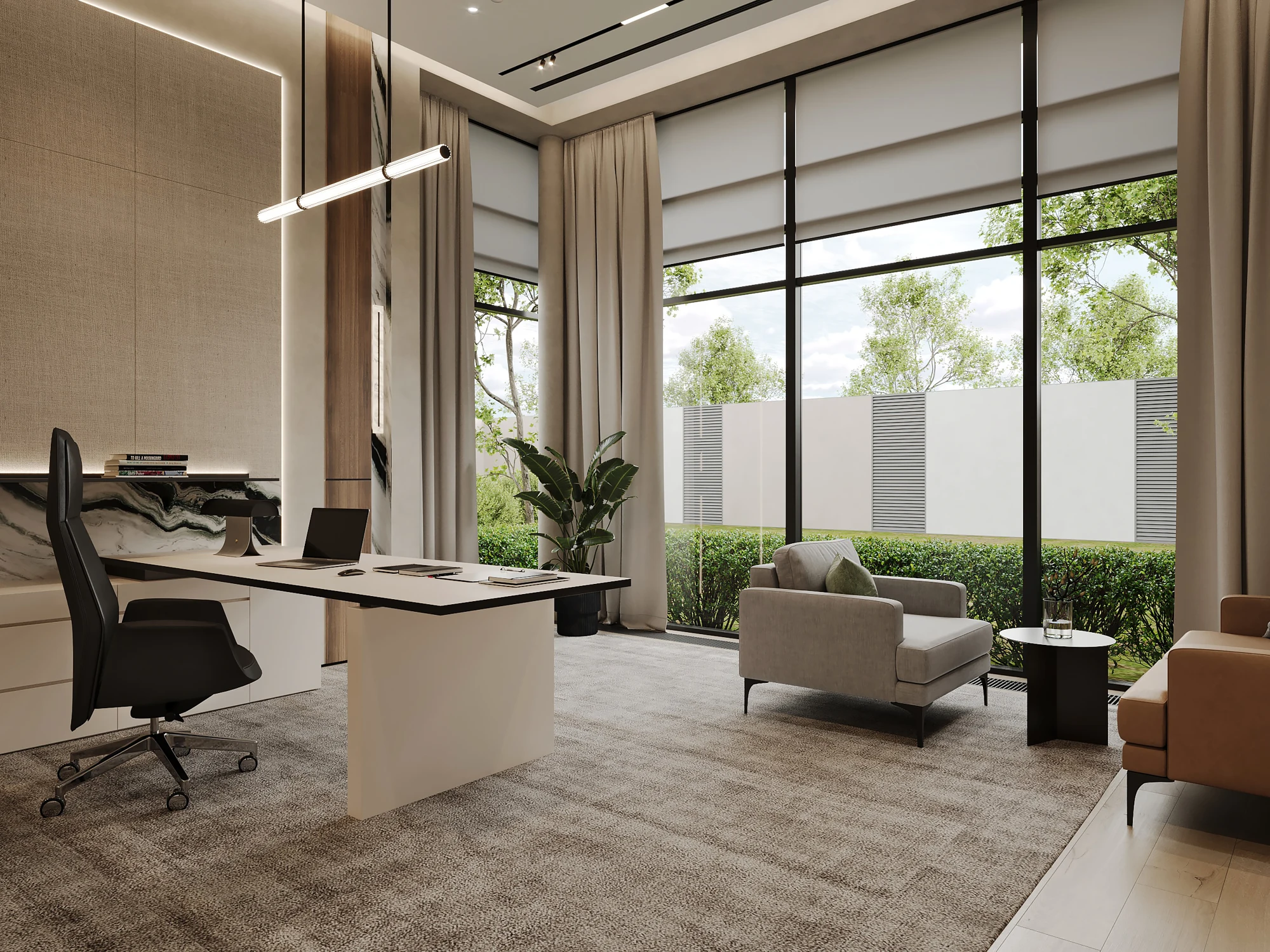 Workspace beside tall garden-facing windows and a lounge chair