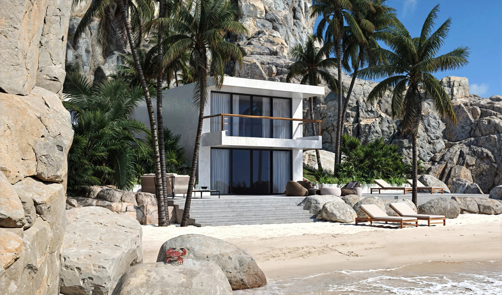 Wide beach view of the white villa set among palms and rocky cliffs